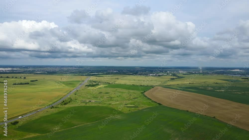 Aerial view from the field to the city with rain clouds in Ukraine Aerial view from the field to the city with rain clouds in Ukraine