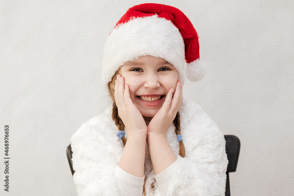 New Year's holiday. Portrait of a little girl with a Christmas style and gifts. New Year's holiday. Portrait of a little girl with a Christmas style and gifts.