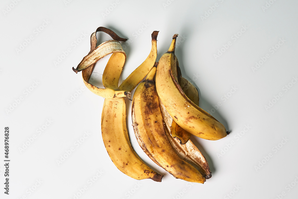 Banana peels or banana skin. Using banana peels in compost, for skin care, hair  health and first aid. Health benefits of banana peel Stock Photo | Adobe  Stock