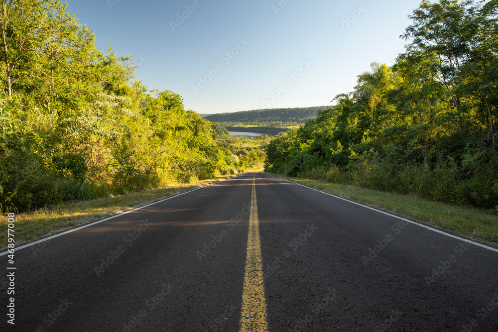 Freedom. View of the asphalt road across the green tropical rainforest. Freedom. View of the asphalt road across the green tropical rainforest.