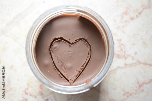 Picture of a heart shape on the surface of chocolate spread
