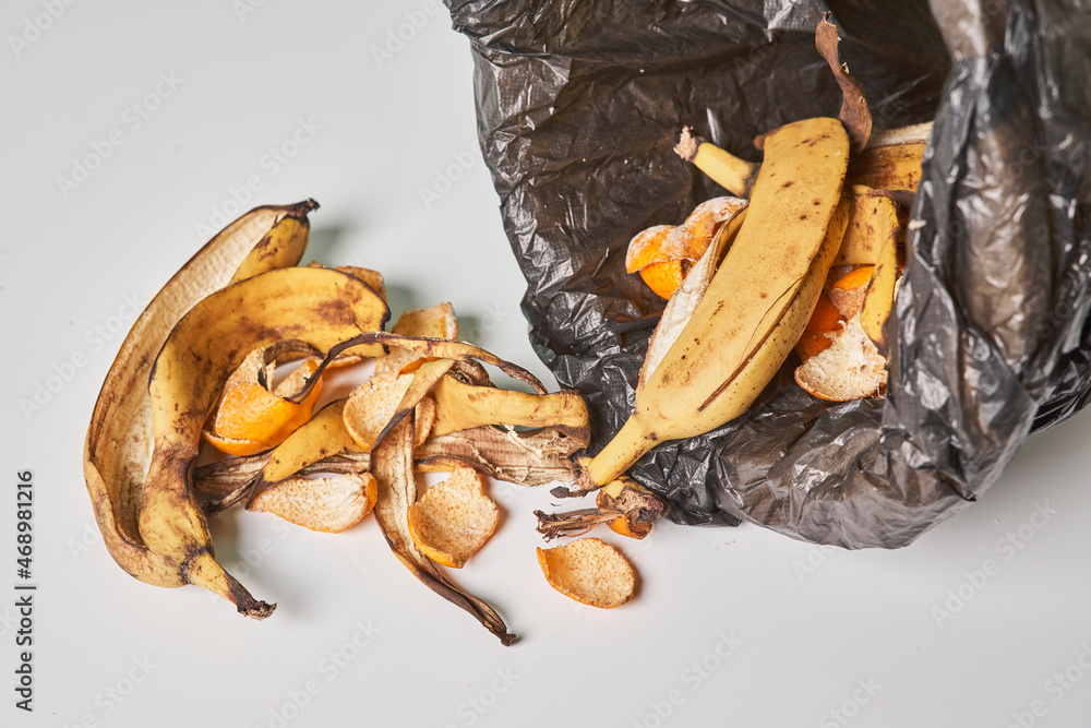 Banana peels in trash can. Using banana peels in compost. Banana skin