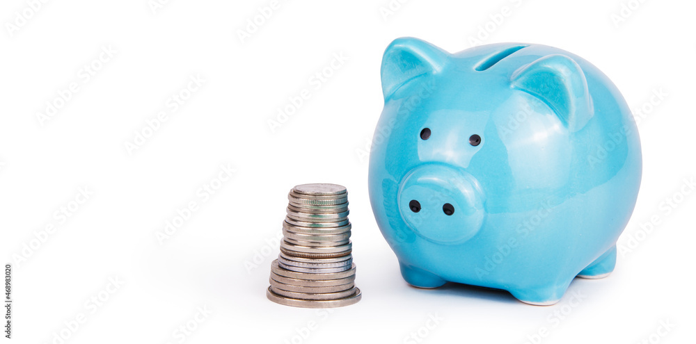Piggy bank and stack of coins on white background. Money box copy space