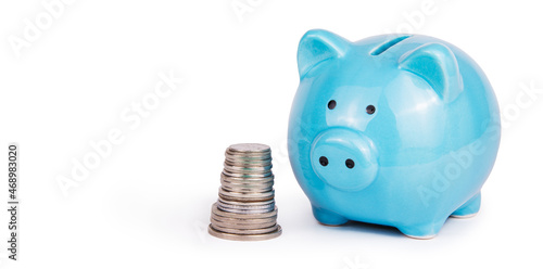 Obraz na płótnie Piggy bank and stack of coins on white background. Money box copy space w salonie