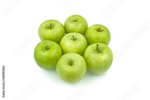 Fresh green apples put on white
