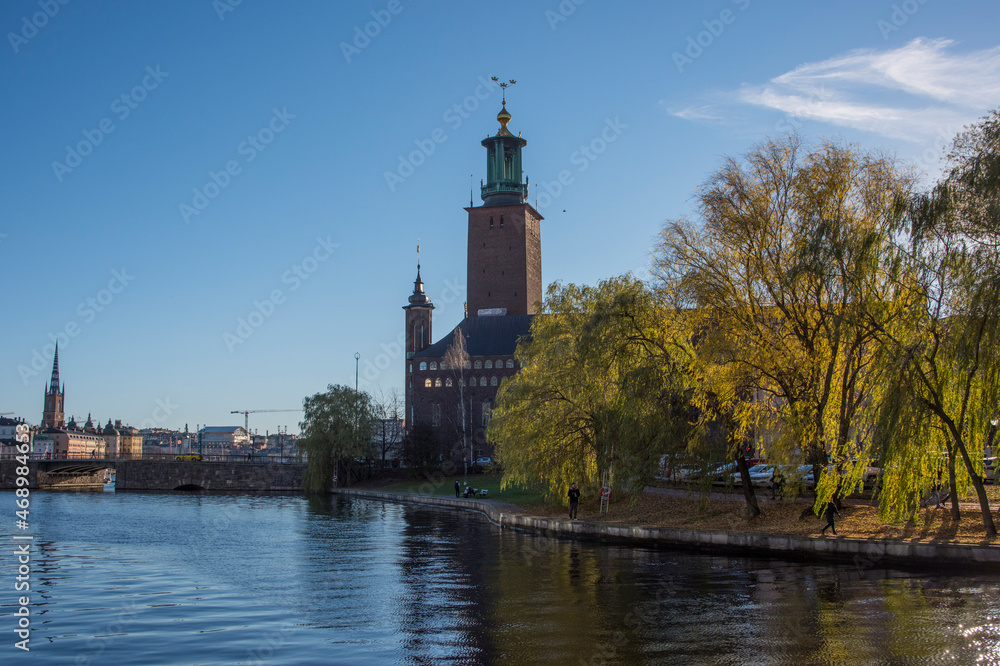 The Stockholm Town City Hall, Stadshuset, and the bridge Stadshusbron from the channel Karlbergskanalen a colorful autumn day in Stockholm