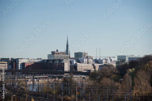 View over Stockholm central station with surrounding office building, rail yard, the busy road Klara Strandsleden and the Channel Klara sjö a colorful autumn day in Stockholm