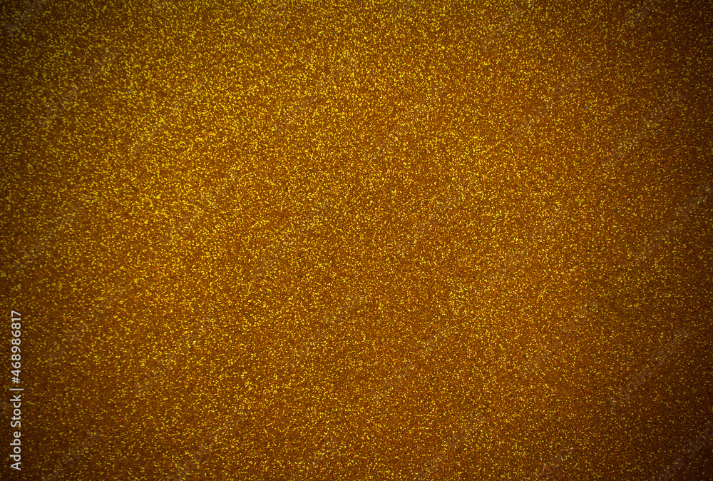 Golden background with sequins. Golden foamiran with grainy texture and vignette. Golden background with sequins. Golden foamiran with grainy texture and vignette.