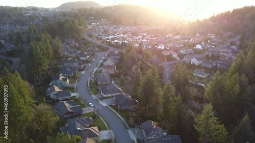Aerial view of typical middle-class residential houses and city street in Portland Oregon. Establishing shot of American neighborhood in a city suburb.