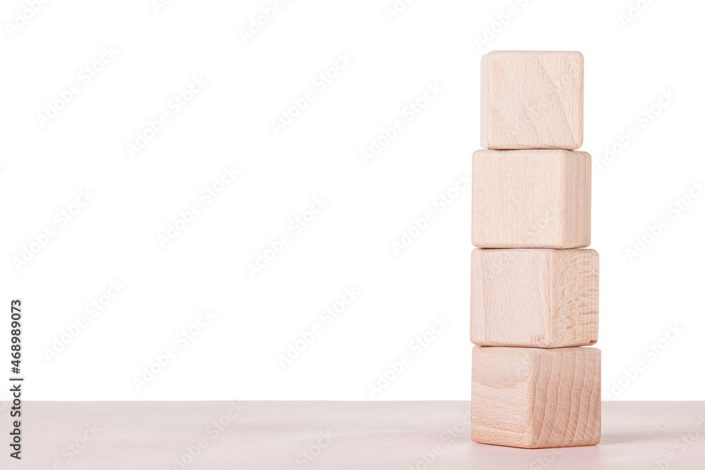 Four wooden cubes on a white background Four wooden cubes on a white background