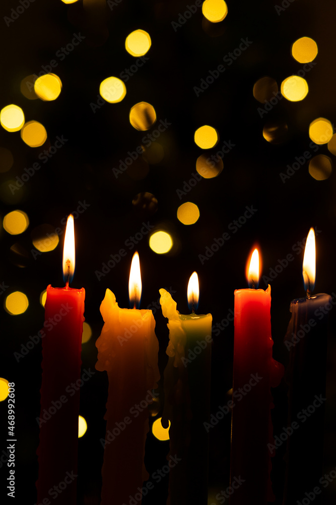 Candlelight Day. Traditional Colombian holiday. Group of candles lit at night with unfocused lights in the background. Candlelight Day. Traditional Colombian holiday. Group of candles lit at night with unfocused lights in the background.