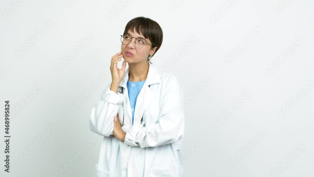 Young woman with nurse uniform intending to realizes the solution while lifting a finger up over isolated background Young woman with nurse uniform intending to realizes the solution while lifting a finger up over isolated background