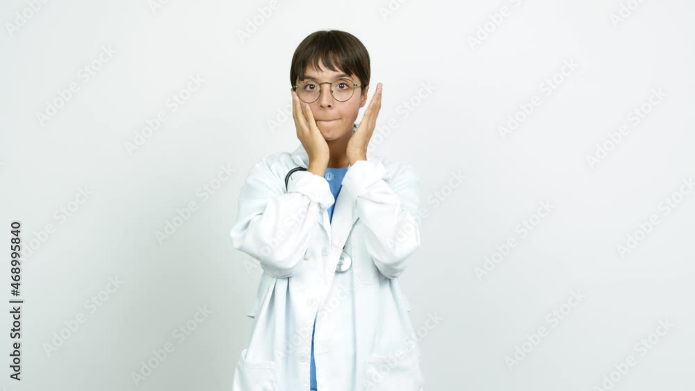Young woman with nurse uniform gaping because have just surprised with a gift over isolated background Young woman with nurse uniform gaping because have just surprised with a gift over isolated background