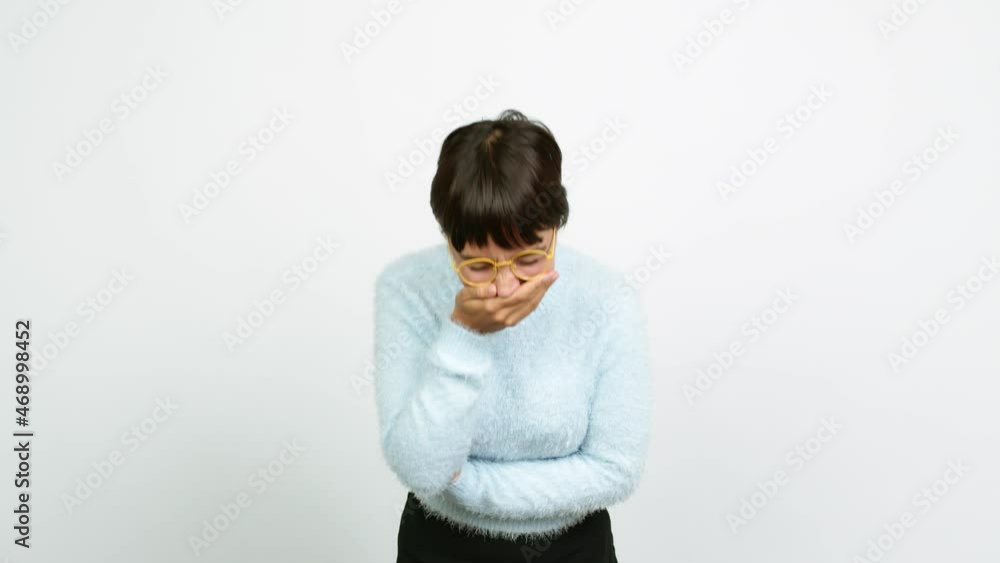 Young woman smiling a lot while covering mouth over isolated background Young woman smiling a lot while covering mouth over isolated background