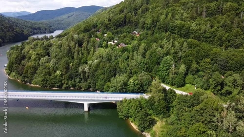 Lake bridge. Cars on th road. View of the Ruzin reservoir on the outskirts of Kosice. River and trees. Drone Video. Slovakia. Europe photo