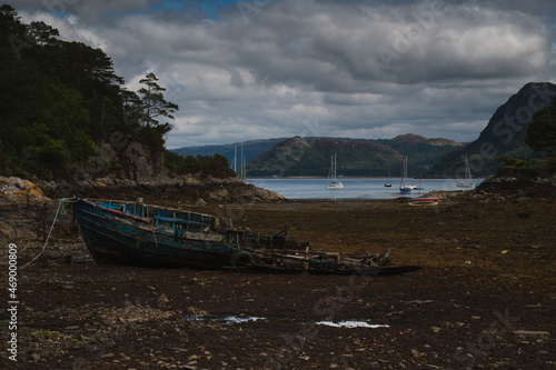  Ruins of a fishing boat at low tide.