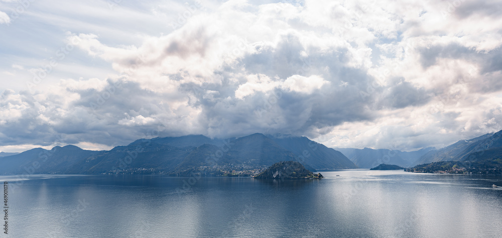 Sun shines through the clouds over Lake Como. Bellagio, Italy