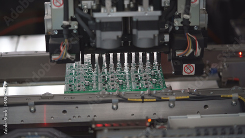 Production of high techonology circuit board. Close up making circuit board. 