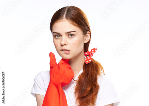 cleaning lady in red rubber gloves posing fun light background