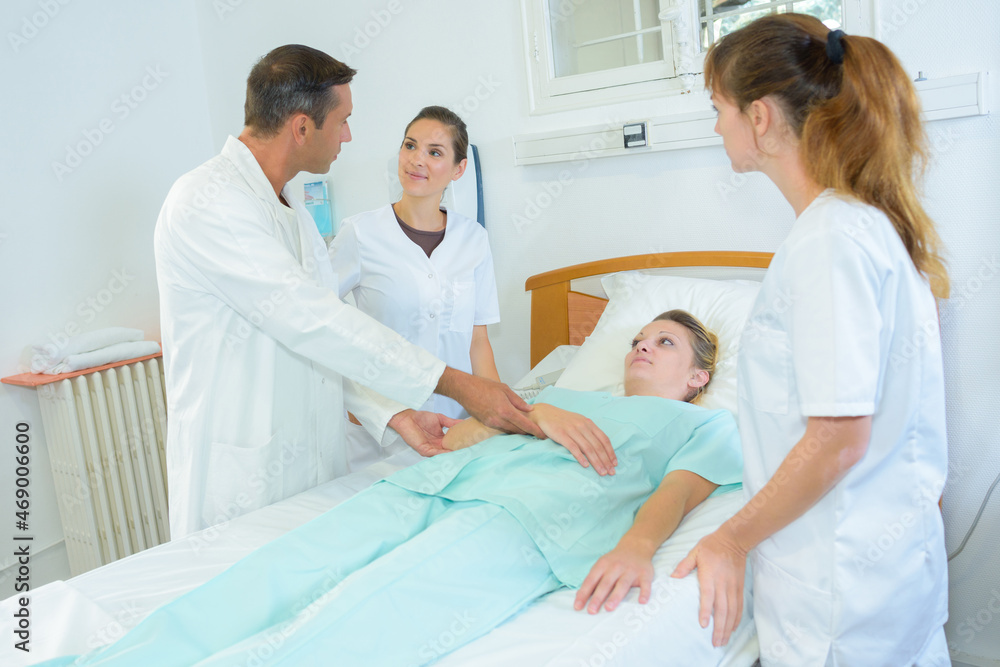 Fototapeta premium nurses practicing how to roll a patient