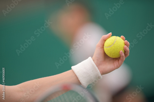 hand holding tennis ball © auremar