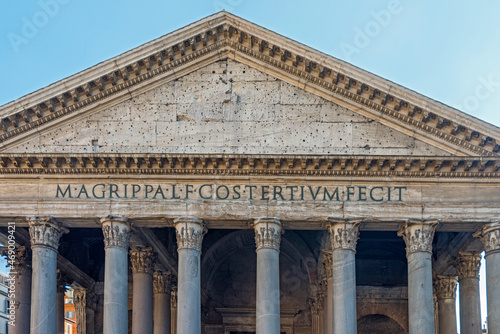 The Pantheon, a building completed by the emperor Hadrian in 126 AD. It is circular with a portico of large granite Corinthian columns; its dome is the world's largest unreinforced concrete dome. Rome