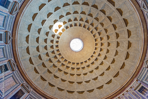 The Pantheon  a building completed by the emperor Hadrian in 126 AD. It is circular with a portico of large granite Corinthian columns  its dome is the world s largest unreinforced concrete dome. Rome