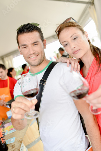 Couple tasting wine at an event