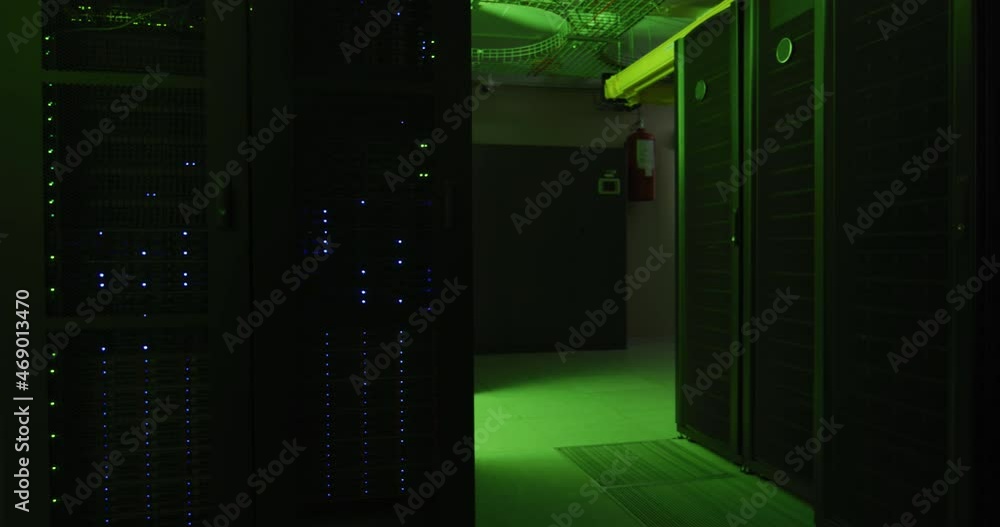 Green control lights flashing with data processing on computer servers in tech room Green control lights flashing with data processing on computer servers in tech room