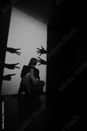 man and shadows from the hands.
