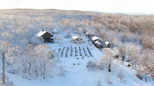 Aerial footage of dogs huts. Husky farm not far from Petropavlovsk Kamchatsky city in Kamchatka, Russia. Dog sledding in Russia. photo
