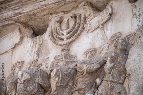 The panel depicts the spoils taken from the Temple in Jerusalem in the Arch of Titus, as The Golden Menorah carved in deep relief. This is unique Biblical Menorah model made by Moses. Rome, Italy. photo