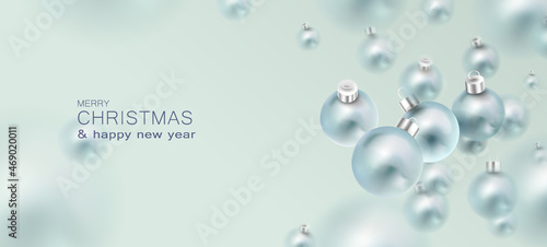 Banner with festive levitating Christmas balls in a minimal style.