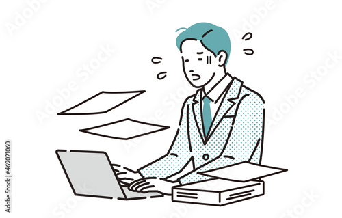 残業しているビジネスパーソン男性