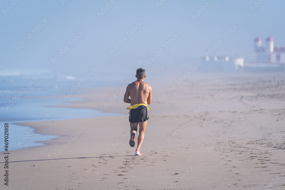 unknown fit person running on the beach of La Serena, Chile unknown fit person running on the beach of La Serena, Chile