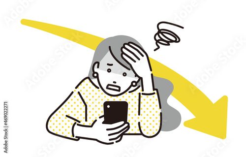 スマホを見て落ち込む女性