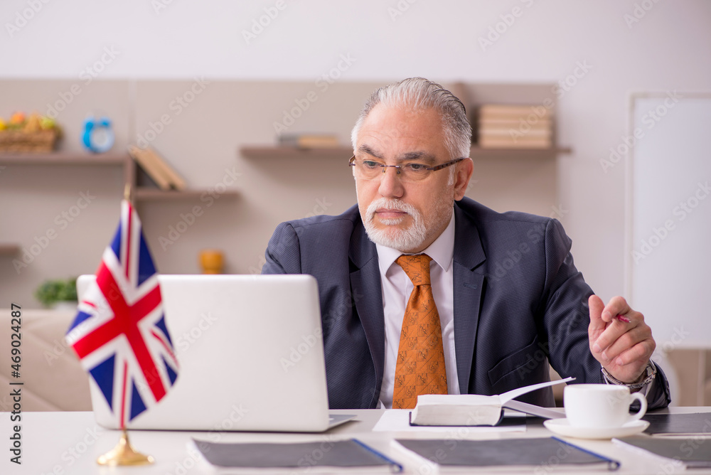 Old male employee working from home during pandemic Old male employee working from home during pandemic