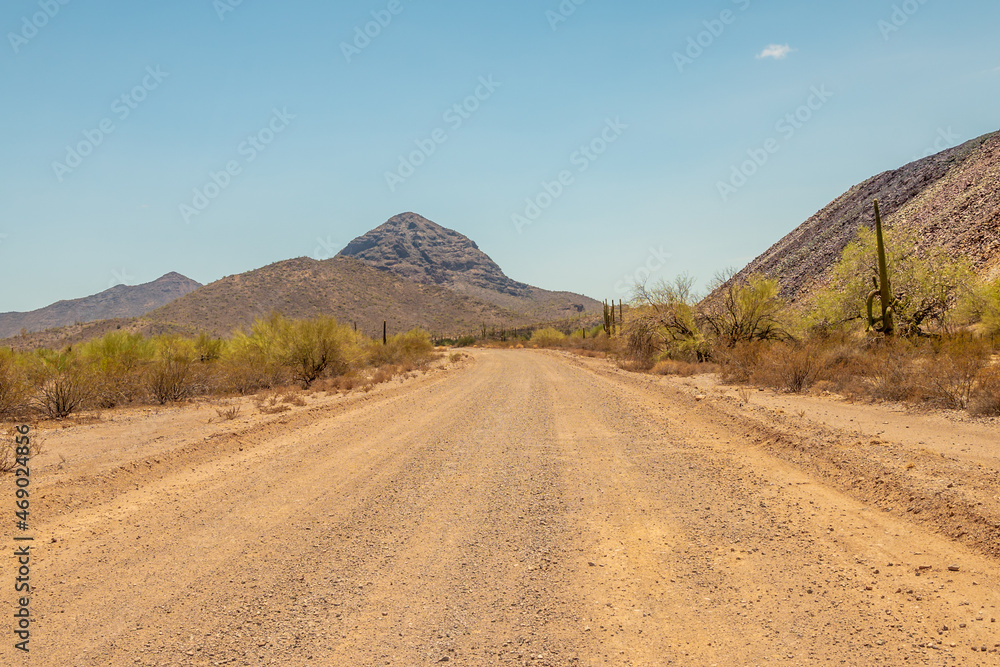 Dusty road leading to a mountain in Arizona