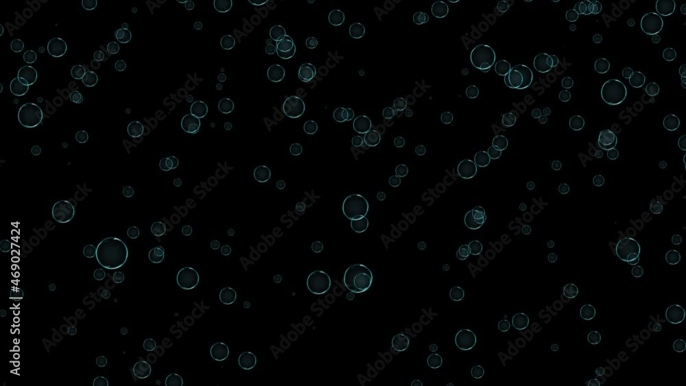 Bluish bubbles measuredly, without deviating to the sides, rise from top to bottom against a black background. Bluish bubbles measuredly, without deviating to the sides, rise from top to bottom against a black background.