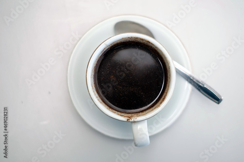  cup of black coffee on a white table