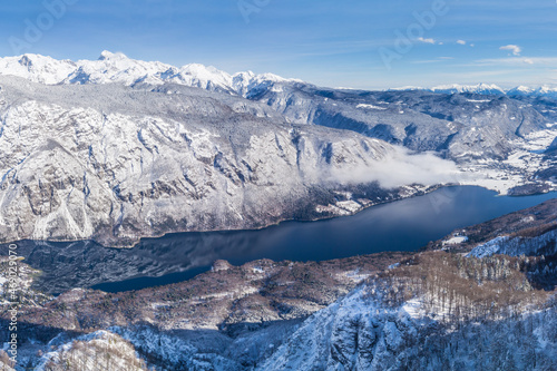 A view of the Lake Bohinj and the surrounding mountains in winter