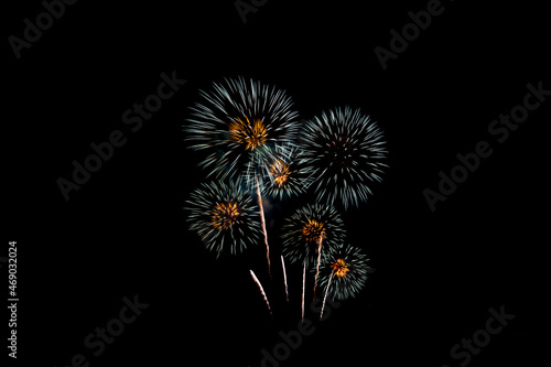Many flashing colorful fireworks in event amazing with black background celebrate New Year  holiday and festival in night.