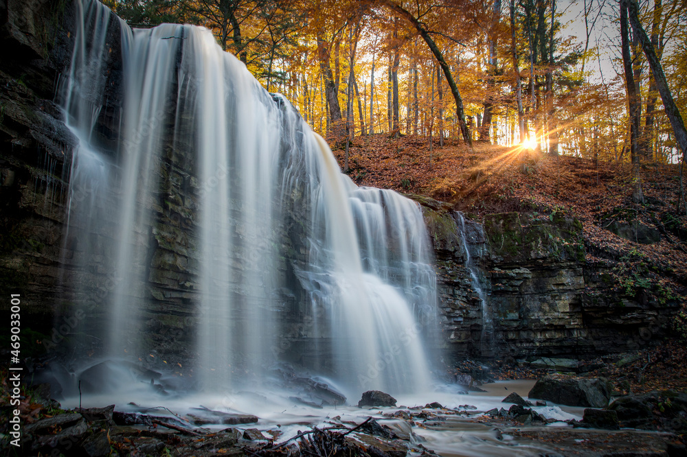 The blurred water of Terrace Falls, one of several waterfalls in Short Hills Provincial Park near St. Catherines, Ontario, cascades over a small cliff in a forest. The blurred water of Terrace Falls, one of several waterfalls in Short Hills Provincial Park near St. Catherines, Ontario, cascades over a small cliff in a forest.