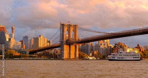 Beautiful Brooklyn Bridge on sunset time with cruise ship