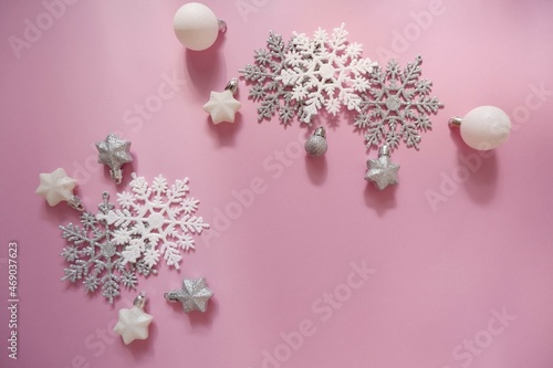 Christmas background with ornaments in pink colors. Xmas celebration, greetings, preparation for winter holidays. Festive mockup, top view, flat lay with copy space. photo