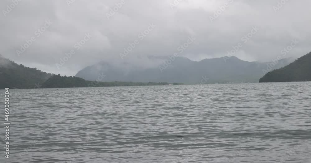 Rough hazy cloudy foggy raining mooning sea ocean wave splash Rough hazy cloudy foggy raining mooning sea ocean wave splash