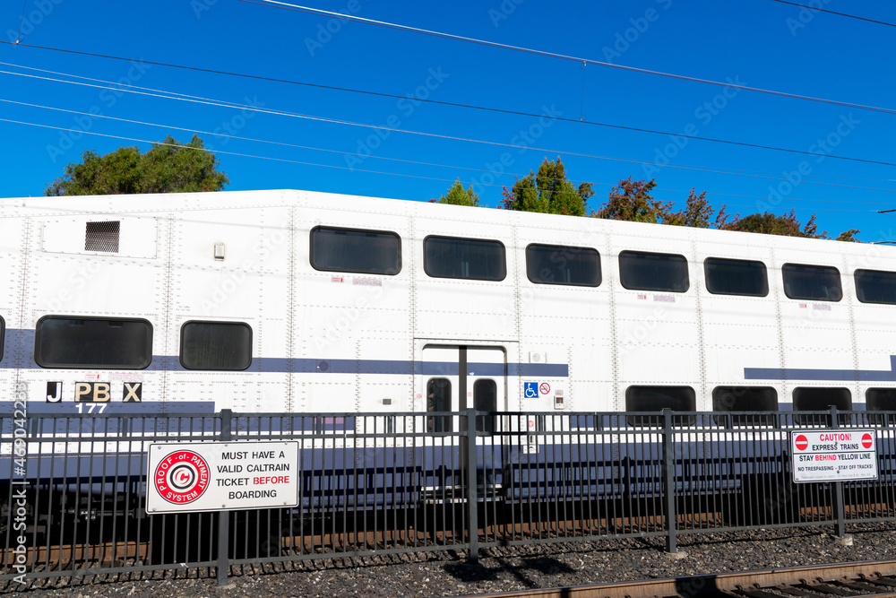 Caltrain bi-level passenger car behind safety fence - San Jose ...
