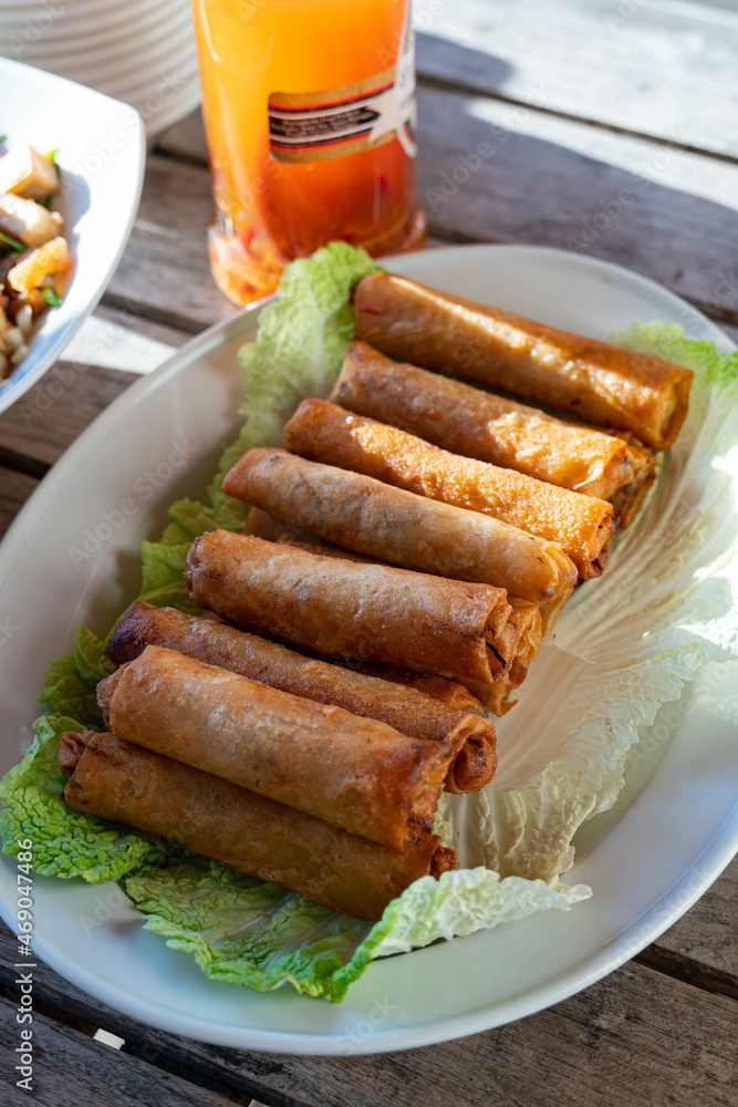 fried lumpiang togue is a common dish in the Philippines that consist of bean sprout, onion, carrots and cabbage wrapped in rice wrappers fried lumpiang togue is a common dish in the Philippines that consist of bean sprout, onion, carrots and cabbage wrapped in rice wrappers
