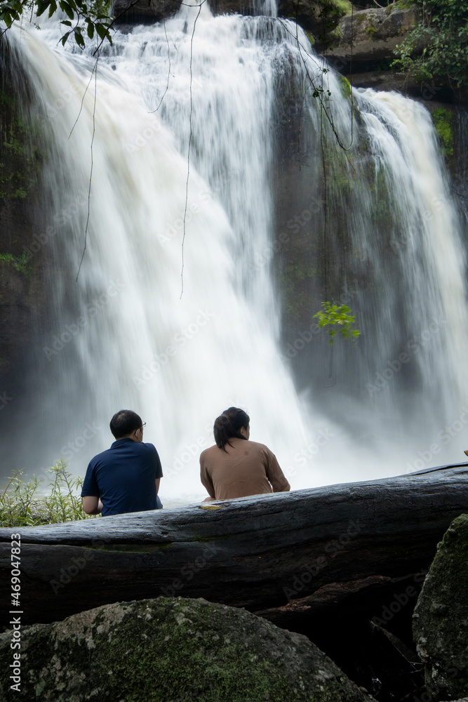 People watch the beautiful nature with trees and mountains, waterfalls. It is a tourist destination for a vacation. People watch the beautiful nature with trees and mountains, waterfalls. It is a tourist destination for a vacation.