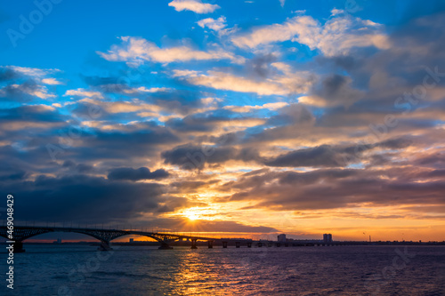 Bridge at sunrise. Beautiful sunrise or sunset scenery view on river bridge silhouette © welcomeinside
